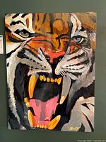 Full view of painting on board showing roaring tiger and signature