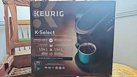 Front of sealed Keurig K-Select K80 box showing product image and key features