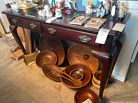 Front view showing two-drawer hall table, hardware, and legs