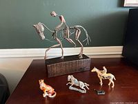 Full lot with sculpture on block base and four small figurines in front