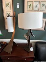 Both lamps side by side on table showing overall form and shades