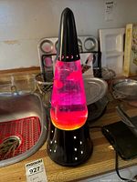 Full view of lava lamp on countertop, power on