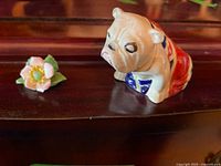Bulldog figurine and Adderley flower ornament side by side