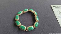 Full view of malachite panel bracelet laid flat