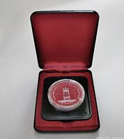 Coin in open presentation case