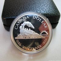 Coin front detail with case behind