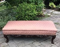 Full view of upholstered bench on patio
