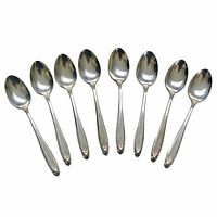 Eight matching Prelude demitasse spoons lined side by side