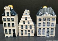 Front view of the three Delft miniature houses