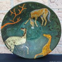 Top view of pottery bowl showing animal motif