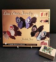 Book and boxed poodle pin front view