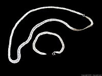 Necklace and bracelet full view on black background