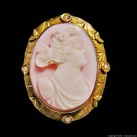 Front view of oval shell cameo brooch pendant