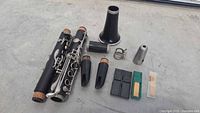 Disassembled clarinet parts and accessories laid out