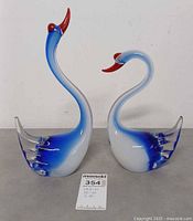 Front view of both Murano glass swan figurines with height reference