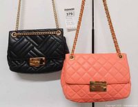 Front view of both Michael Kors Sloan quilted bags showing hardware and chain straps