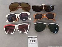 Front view of all six pairs showing frame styles and lens colors