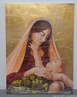Full view of signed Madonna and Child oil painting wrapped in plastic