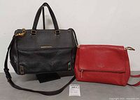 Front view of both handbags showing overall style, color and size
