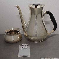 Coffee pot and sugar bowl grouped together