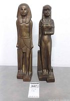 front view of both brass Egyptian statues