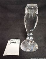 Front view of clear crystal owl figurine on round base