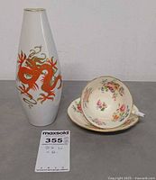 Vase, cup, and saucer together