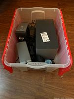 Overview of bin with all speakers and accessories