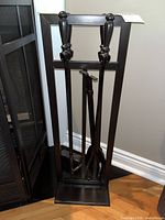 Full view of fireplace tool set on stand