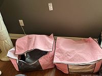 Two pink fabric soft storage cubes with zippered flaps