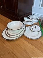 Group shot of all Noritake Chatelaine Platinum serving pieces stacked and arranged