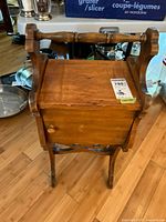 Front view showing cabinet door, spindle handle, overall form