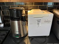 Bread maker and water distiller side by side on counter