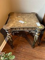 Overall view of square side table showing top, legs, and metal stretcher