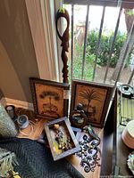 Group shot showing cane, two palm prints, shadowboxes, gecko, circular plaque