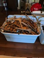 Top view of tote filled with wooden hangers