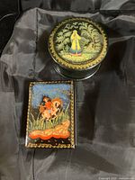 Round and rectangular Russian lacquer boxes top view