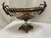 Side view of porcelain compote showing bowl, handles and base