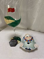 Wine glass and clown dish grouped