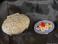 Both pill boxes side by side on black background