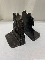 Pair of cast iron bookends side view