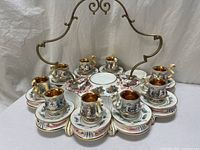 Full view of espresso set on ornate stand showing overall quantity and layout