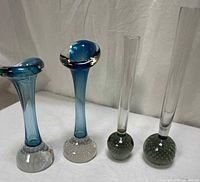 Group shot of all four art glass bud vases standing upright