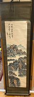Full view of hanging scroll showing artwork, silk border and hanging cord