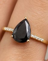 Ring worn on finger showing overall appearance and scale