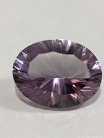Top view of faceted oval light purple amethyst