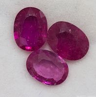 Three oval rubies close-up on white background