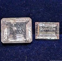 Both morganite gemstones on dark background, showing shape, clarity and inclusions