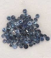 Cluster of loose round blue sapphires