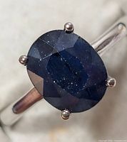 Top view of oval sapphire and prong setting